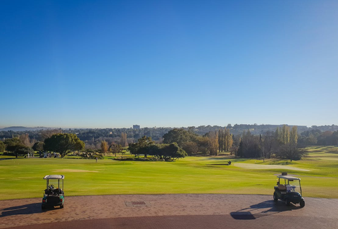 Two golf carts on the course