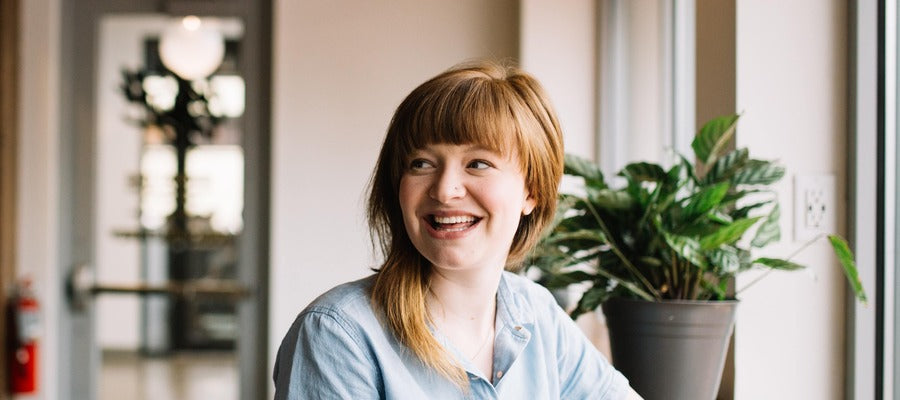 woman smiling in an office setting