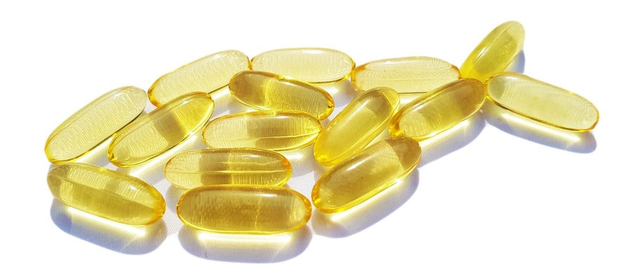 omega-3 capsules arranged into the shape of a fish