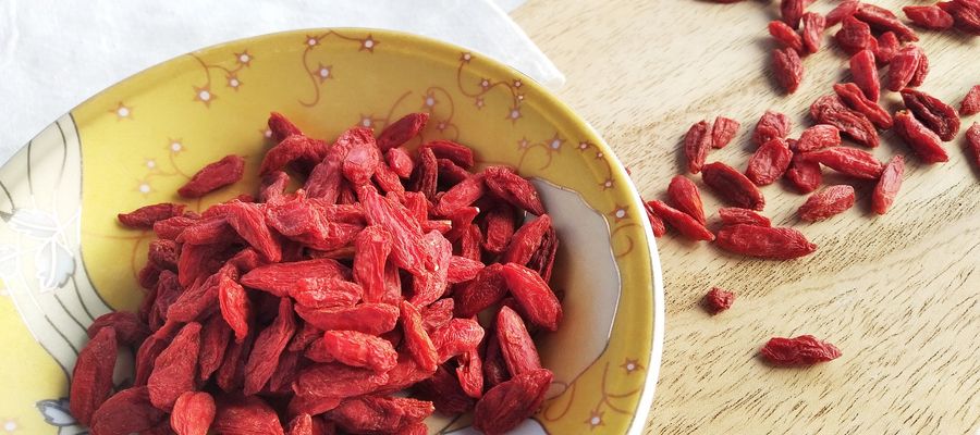 goji berries in a dish and on table