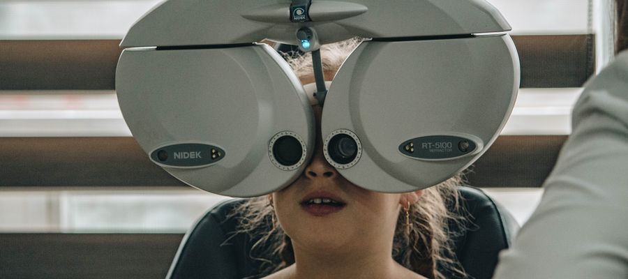 girl child undergoing eye exam