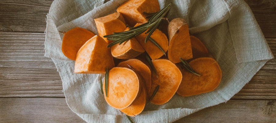 cut sweet potatoes on a cloth on the table