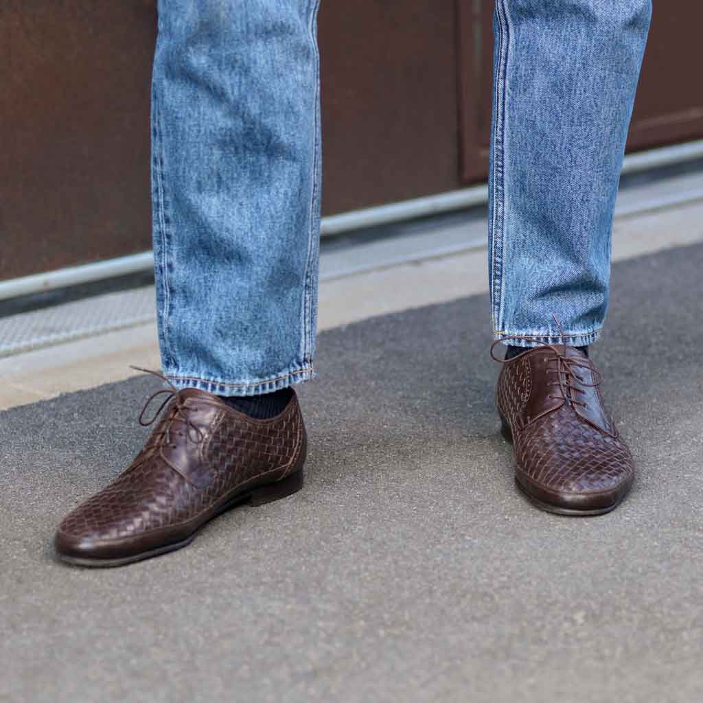 Brown woven shoes and jeans
