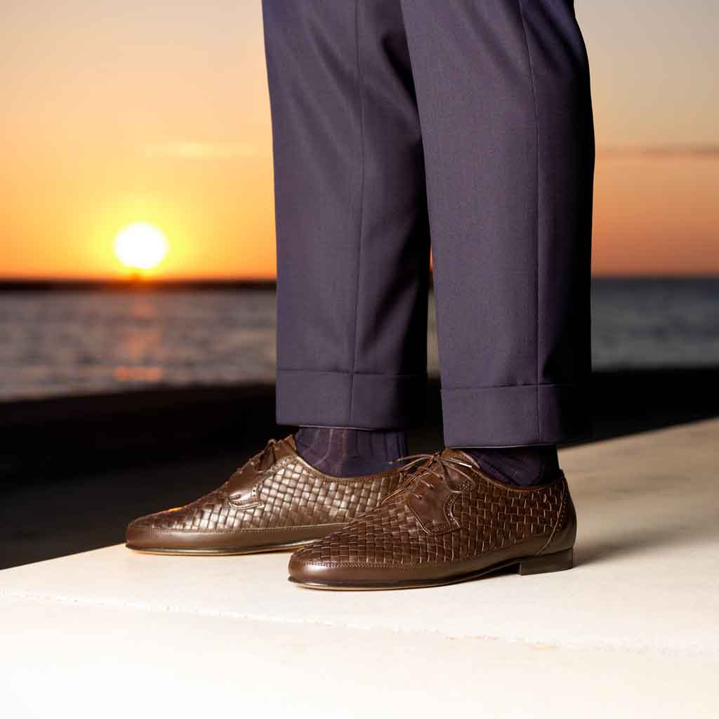 Woven leather shoes and blue suit