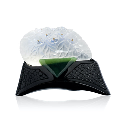 458.50-carat carved moonstone, titled “African Violets.”  Sits on a base of black and green jade with yellow sapphires by Dalan Hargrave, GeoGem-USA.