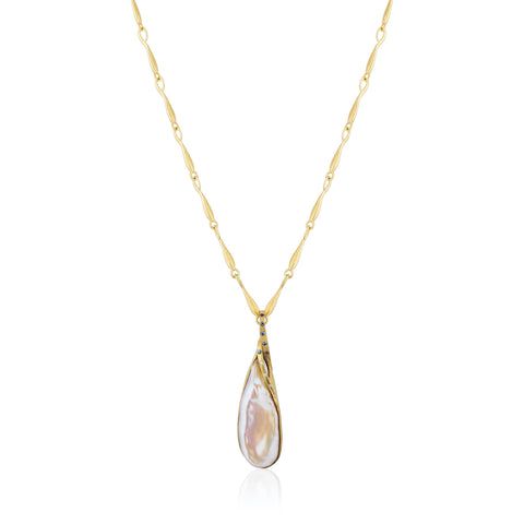 Necklace featuring a pear-shaped cultured freshwater pearl accented with sapphires and diamonds set in 18-karat recycled yellow gold by Eve Streicker, Original Eve.