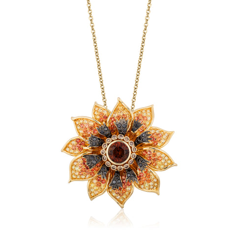 “Brown-Eyed Susan” pendant featuring a 5.30-carat orange Montana sapphire accented with orange and yellow sapphires totaling 8.69 carats and black and cognac diamonds totaling 1.98 carats set in 18-karat yellow gold by Paula Crevoshay, Mellika Company, Inc./ Crevoshay.