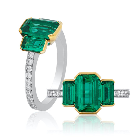 Ring featuring three untreated emerald-cut Colombian emeralds totaling 2.48 carats accented with diamonds set in platinum and 18-karat yellow gold by Oren Nhaissi, EMCO Gem, Inc.
