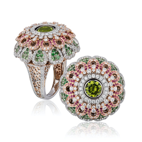 “Chameleon” ring featuring a 3.55-carat rhodolite garnet and a 2.10-carat peridot accented with tsavorite garnets totaling 1.88 carats, pink sapphires totaling 0.70 carat and diamonds totaling 2.07 carats set in 18-karat white and rose gold by Tariq Riaz, Tariq Riaz LLC. The ring features a mechanism that switches the center gem.