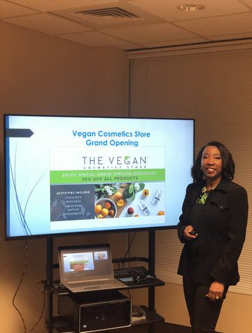 Karlene Facey presenting work to The Vegan Cosmetics Store
