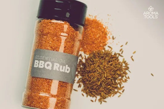 A 4-ounce shaker jar with the BBQ rub that is flavored with black pepper, cumin and ginger essential oils.