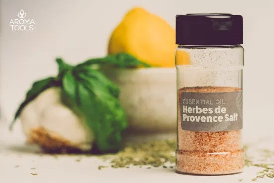 A 4-ounce shaker jar filled with Herbes de Provence salt flavored with basil, thyme, rosemary, marjoram, lemon, lavender and fennel essential oils.