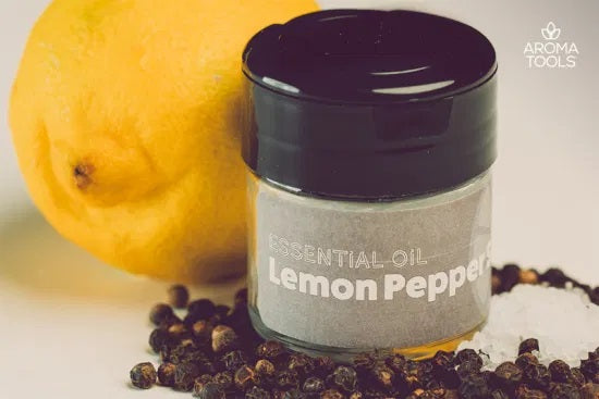 A 1-ounce shaker jar with our lemon pepper seasoning mix with black pepper essential oil.
