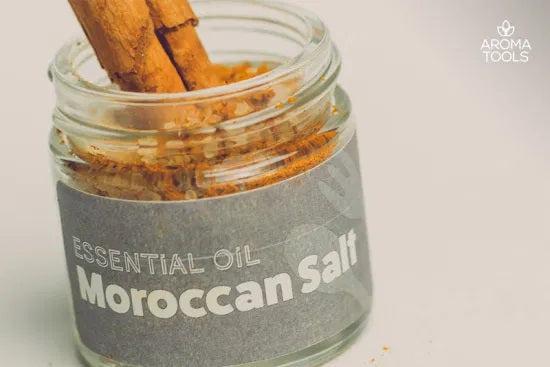 A 1-ounce glass jar filled with our Moroccan salt that is flavored with black pepper, cinnamon, ginger, cardamom and clove essential oils.