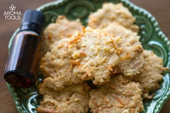 A small plate of lightly toasted lemon coconut crisp cookies made with lemon essential oil.