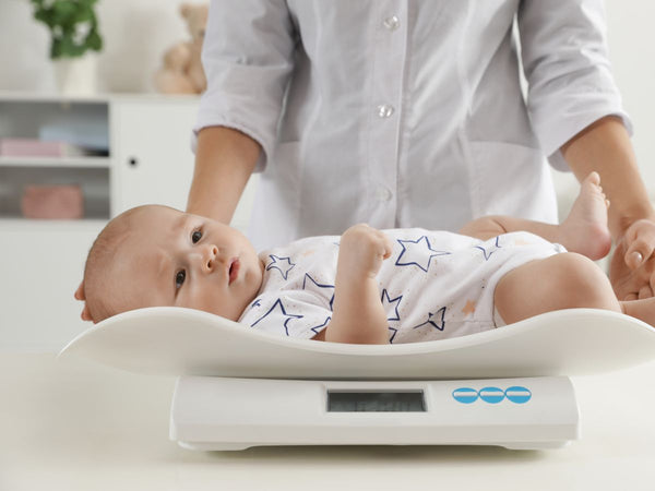 baby being weighed