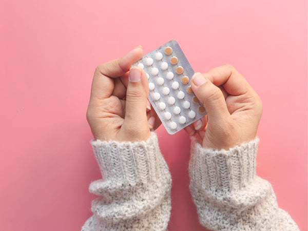 lady holding the contraceptive pill packet