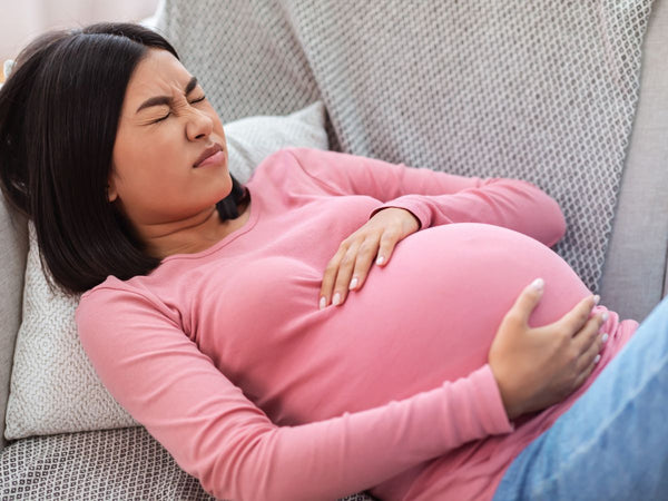 pregnant woman lying on the couch