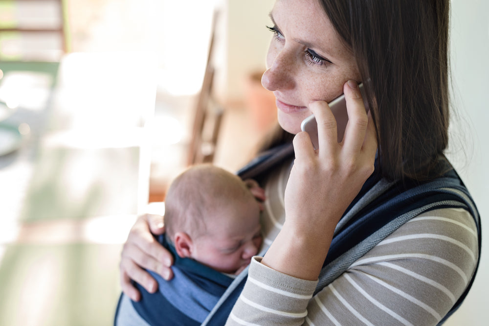 Mother on phone with baby