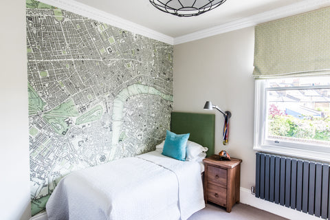 boys bedroom with green map mural green headboard 