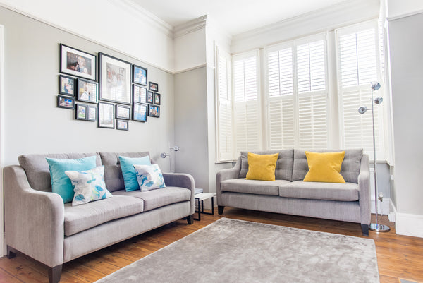 living room scheme, new sofas yellow cushions jacaranda rug and charlotte james furniture