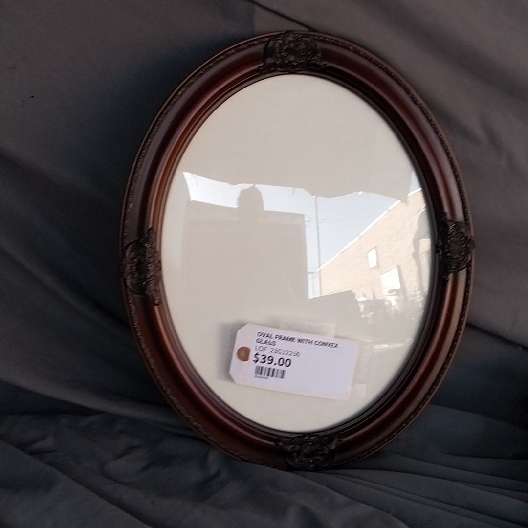 Convex Glass Enclosed in an Oval Frame