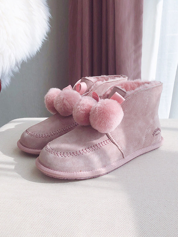 shoes with fur ball on top