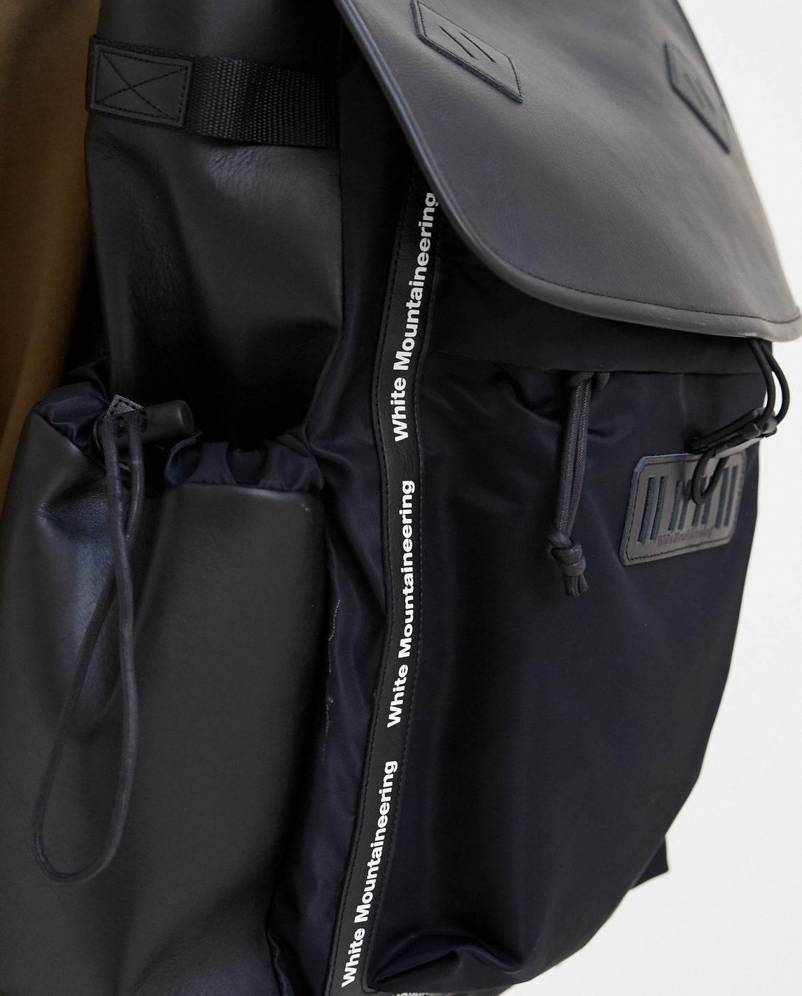 white mountaineering backpack