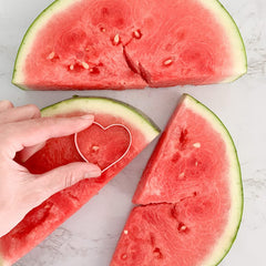 watermelon cut into heart shape with cutter