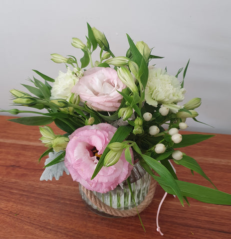 A cute pink & white jar of joy.