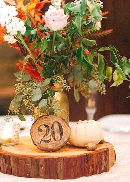 Rustic Engagements - This is often a popular centerpiece amongst our  clients with the wood slab and different variations of decor and/or florals  to make a statement on our couples guest tables!