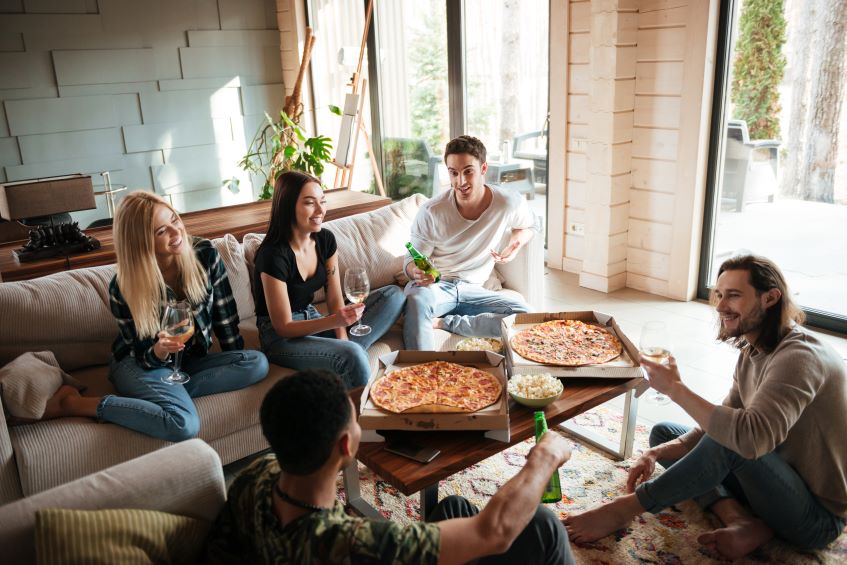 eating pizza and chatting at home