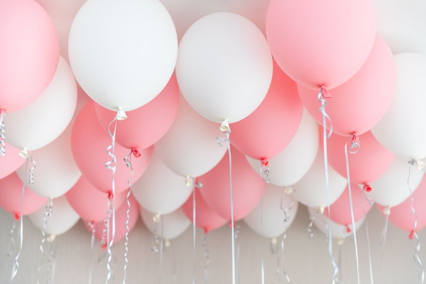 pink and white ceiling balloons