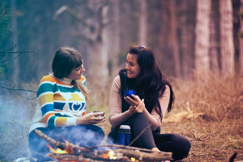 women enjoying the bonfire