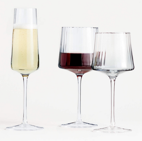 three wine glasses with champagne, white wine and red wine