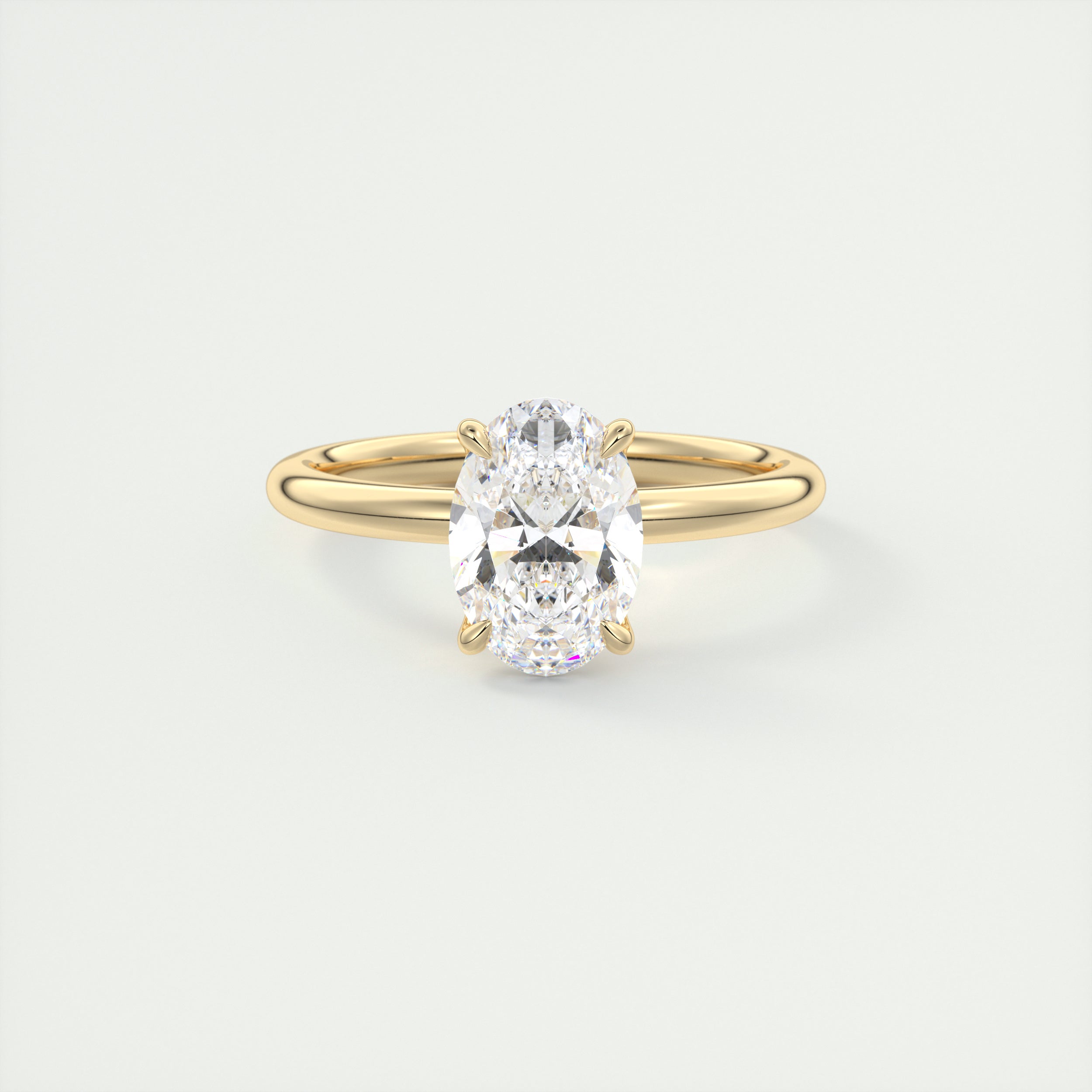 Oval cut solitaire Frank Darling lab grown diamond engagement ring with floral prongs, low profile basket and 1.8mm band in yellow gold