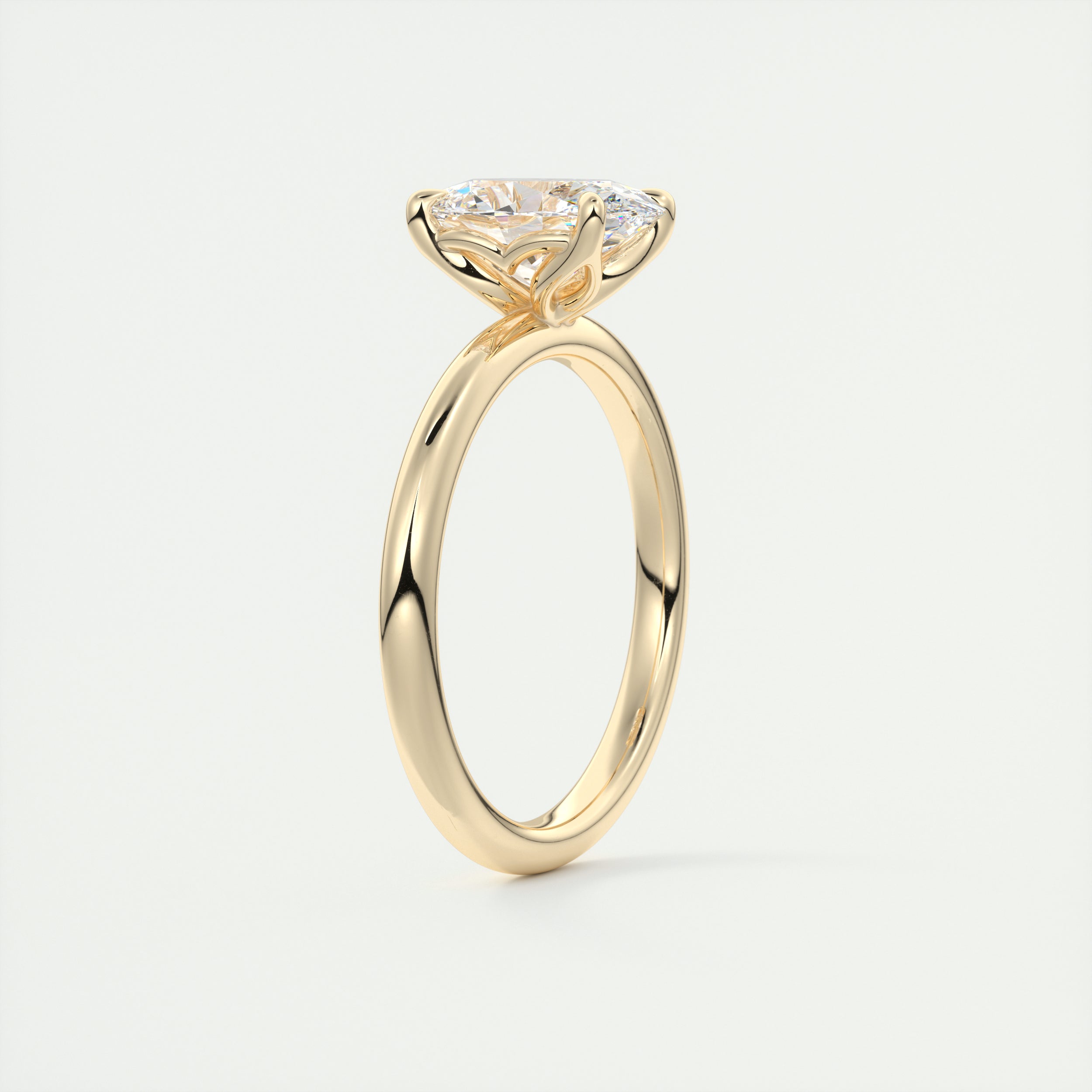 Oval cut solitaire Frank Darling lab grown diamond engagement ring with floral prongs, low profile basket and 1.8mm band in yellow gold