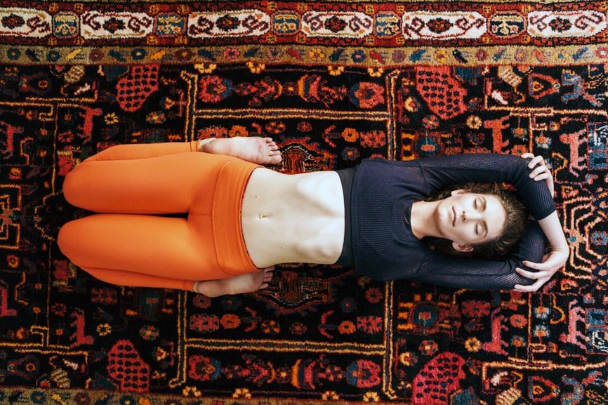 woman stretching for gut health