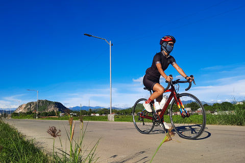 Kristina is riding her bike in full Ciclo Women's Apparel: Nightrider Jersey, Endurance Shorts, and Haru Socks