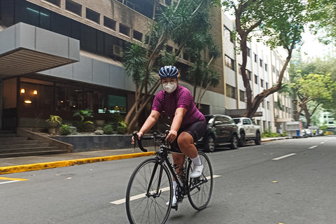 Maia wears the Ciclo Women's Arrowhead Jersey while riding her bike in Makati