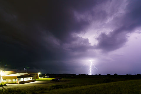 Lightning strikes near a building and roadside in Kansas