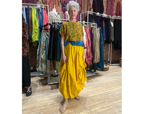 yellow and blue patterned boxy top paired with mustard tashi pants