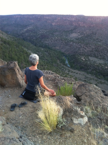 Mercedes meditating in the desert