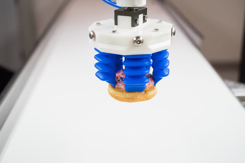 mGrip soft robotics holding a donut