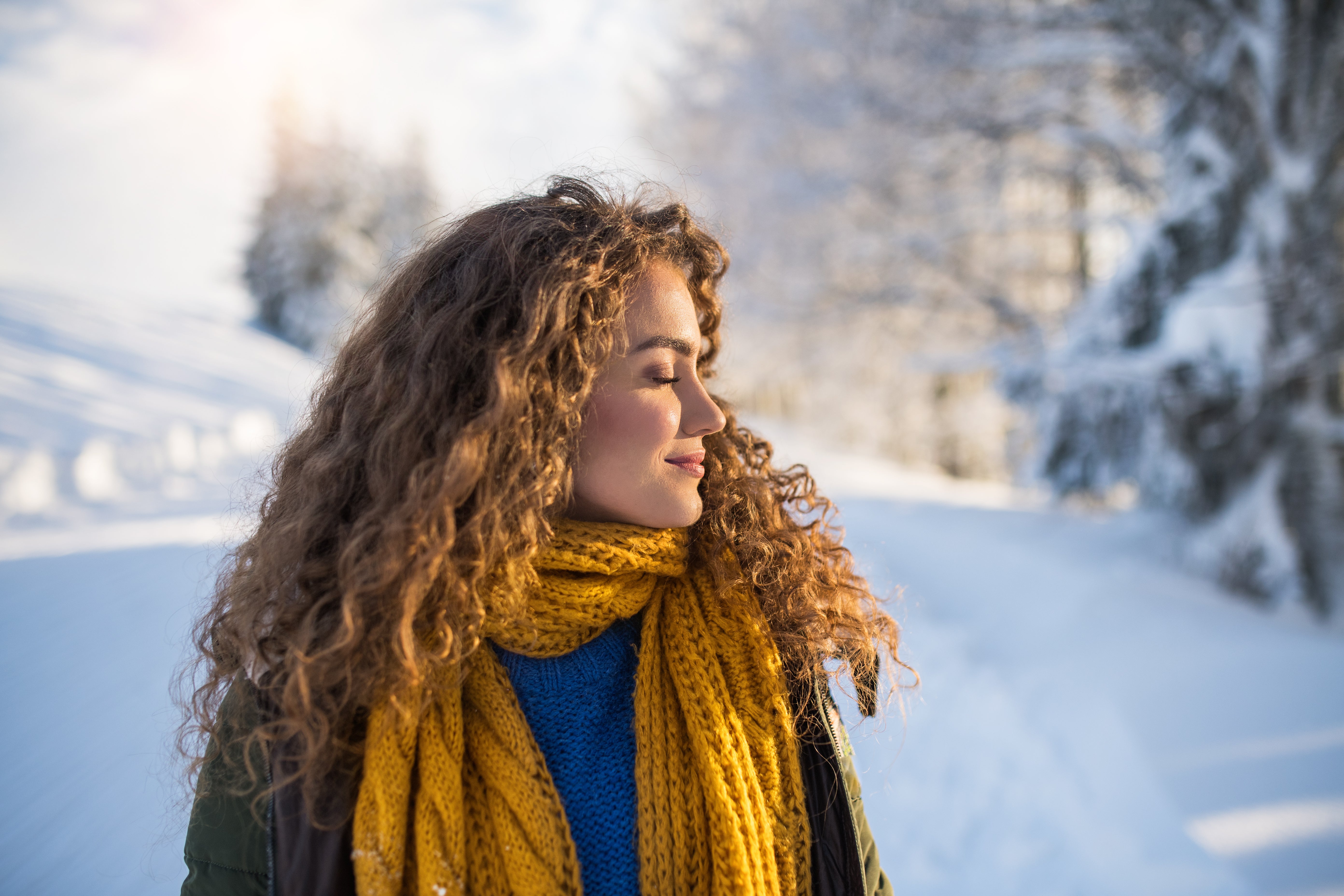 woman in a wintery environment, cold, snow