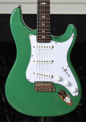 dark green electric guitar