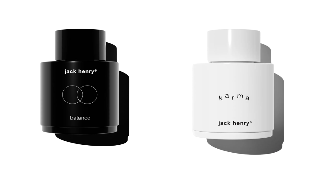 Two Jack Henry skincare product containers, one black labeled 'balance' and one white labeled 'karma'.