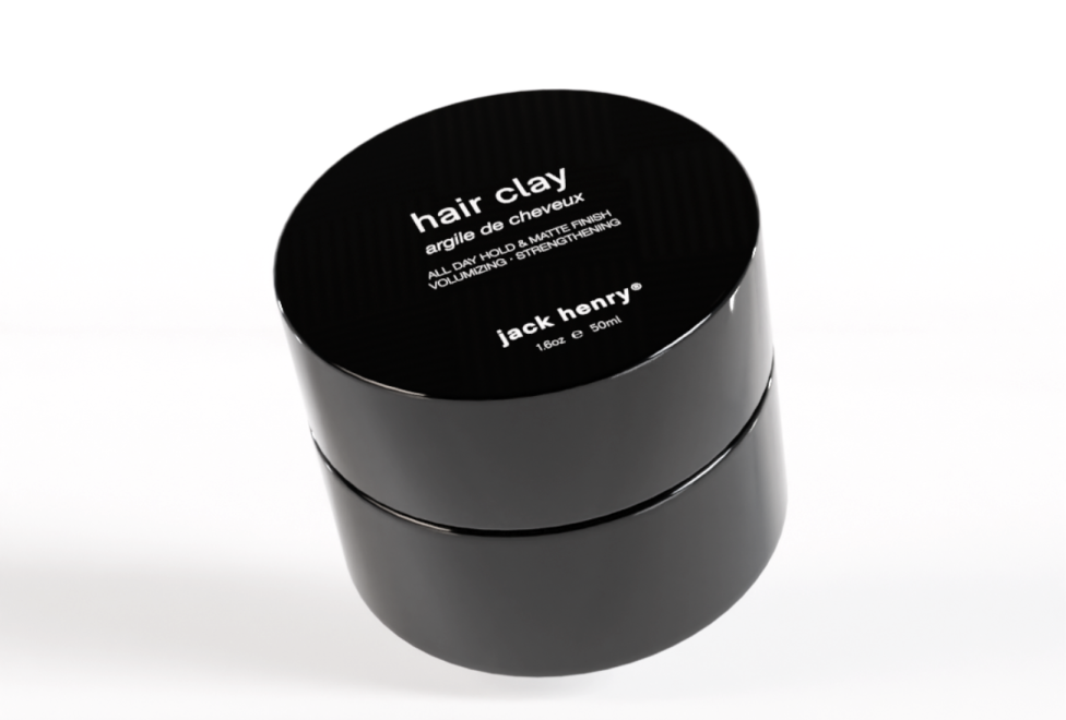 A black jar of Jack Henry hair clay on a white background.