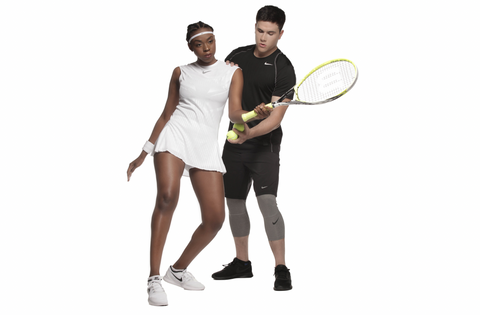 Black-female-tennis-player-white-male-instructor-exercise-