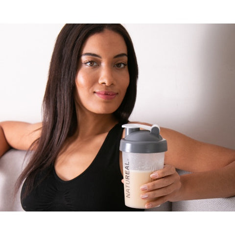 Woman-holding-best-whey-protein-shake